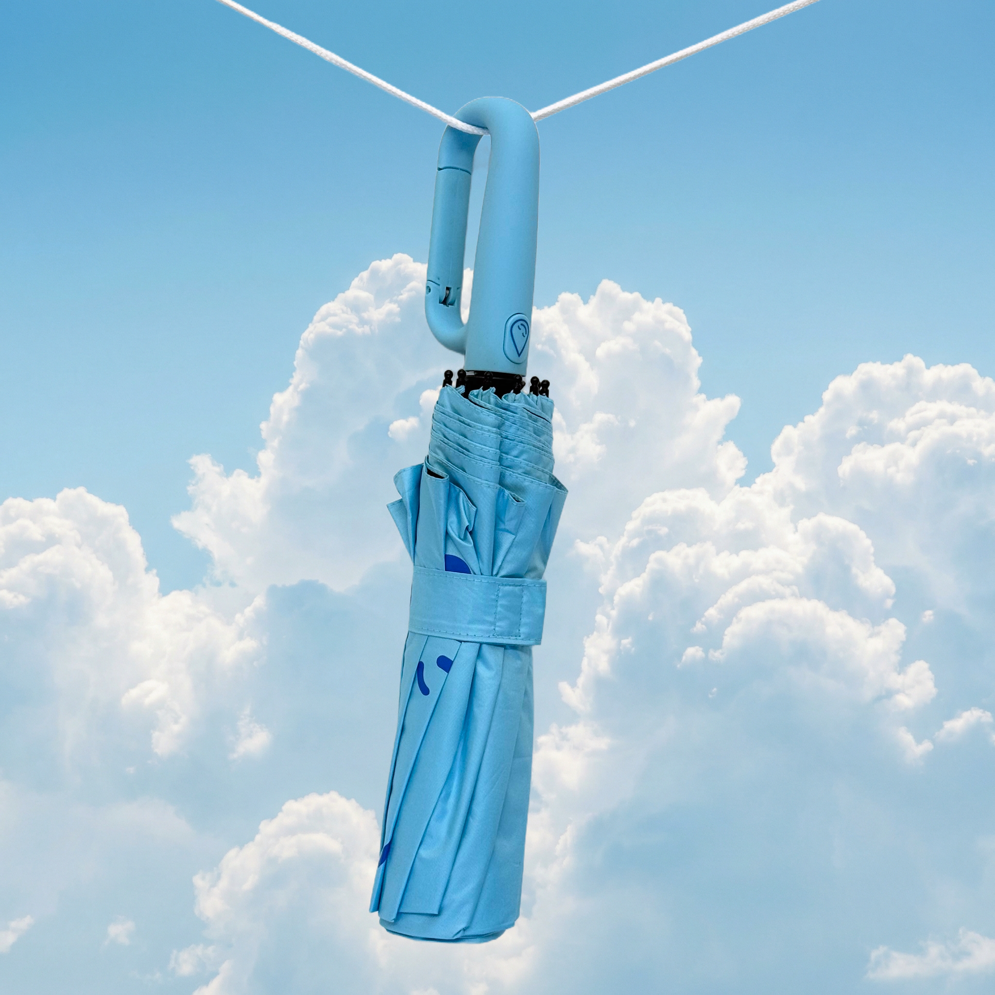 Topaz umbrella hanging against a blue sky with clouds