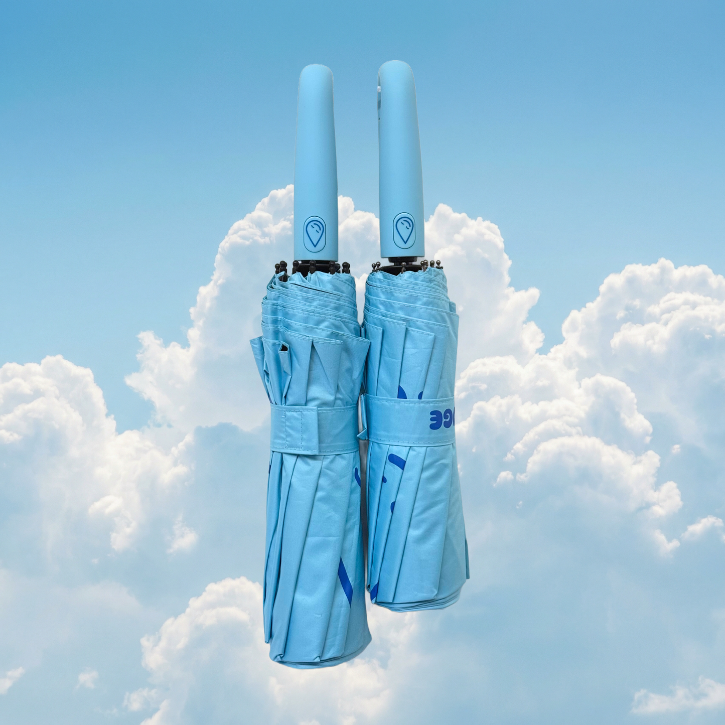 Two topaz umbrellas with a brand logo against a cloudy sky background