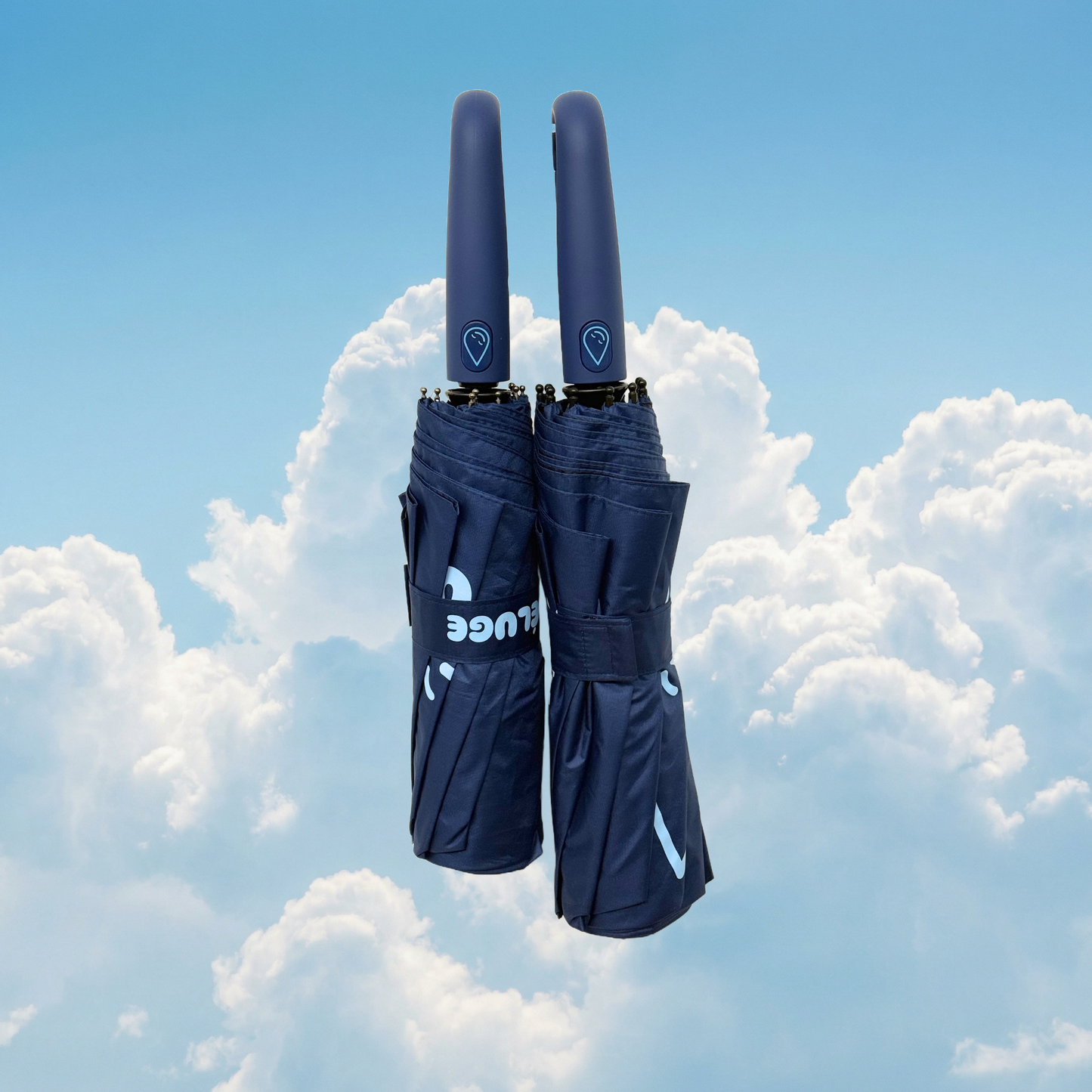 Two navy umbrellas with a visible brand logo against a cloudy sky background